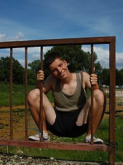 Small twink guy posing naked outdoors