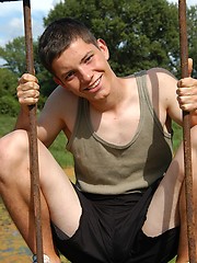 Small twink guy posing naked outdoors