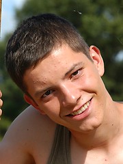 Small twink guy posing naked outdoors