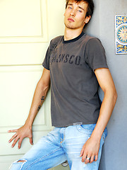 Pretty blue-eyed stud takes off his jeans and shirt
