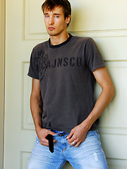 Pretty blue-eyed stud takes off his jeans and shirt