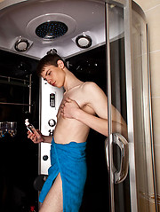 Bold twink enjoys a nice tug job in a shower cabin