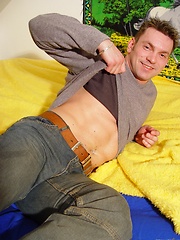 Nude gay stud solo relaxing in the bedroom
