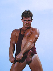 Muscled hunk shows his body and cock