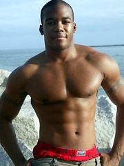 Young black stud demonstrates his athletic body