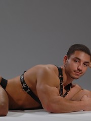 Police man posing in leather clothes