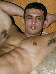 Brunette guy showing his perfect latin body