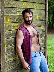 Muscled guy with hairy chest bares his sexy body