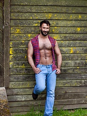 Muscled guy with hairy chest bares his sexy body