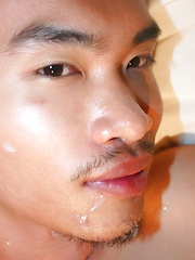 Asian guy Vodga is receiving a hot golden shower from his friend before facial