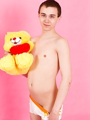 Straight guy Timmy Wright exposes his body with teddy in hands