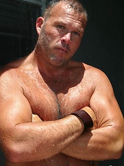  King-sized Brock Hart cools down in an outdoor shower