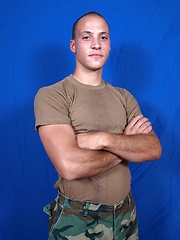 A very soft spoken military boy uses toy before camera