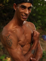 Bronzed guy shows his beefy body