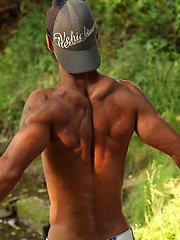 Bronzed guy shows his beefy body