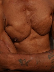 Bronzed guy shows his beefy body