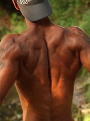 Bronzed guy shows his beefy body