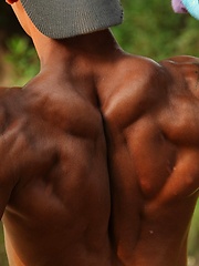Bronzed guy shows his beefy body