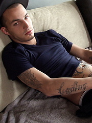Jacob Pike sitting in the coach and stroking cock