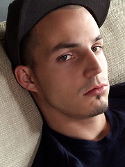 Jacob Pike sitting in the coach and stroking cock