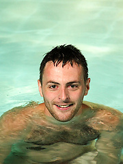 Riley lies on the pool side and plays with his hairy arse
