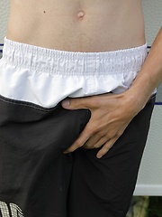 Smooth chested Luigi busts a nut in front of his camper.