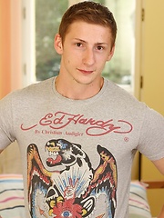 Uncut hung stud Alex Saikov busts a nut on his stomach.